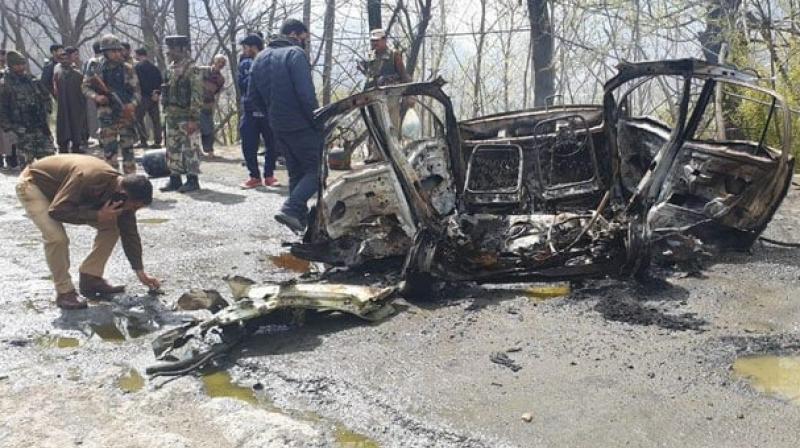 A CRPF vehicle had suffered slight damage when a Santro car went up in flames after an explosion at Tethar village, seven kms from Banihal, shortly after a Jammu-bound convoy crossed the Jawahar Tunnel, the gateway to Kashmir valley. (Photo: ANI) A CRPF vehicle had suffered slight damage when a Santro car went up in flames after an explosion at Tethar village, seven kms from Banihal, shortly after a Jammu-bound convoy crossed the Jawahar Tunnel, the gateway to Kashmir valley. (Photo: ANI)