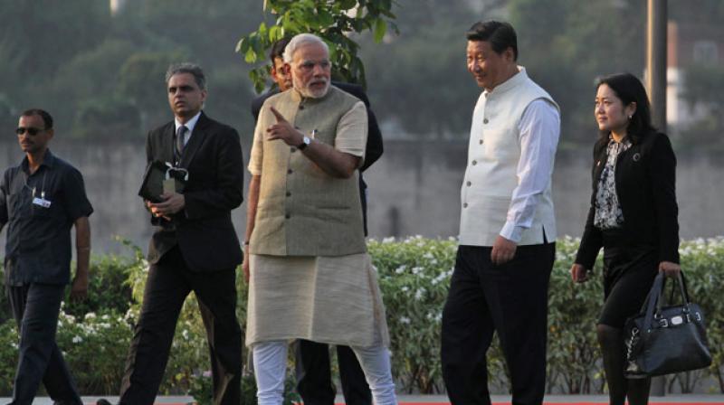 Prime Minister Narendra Modi talks to Chinese President Xi Jinping. (Photo: AP) Prime Minister Narendra Modi talks to Chinese President Xi Jinping. (Photo: AP)