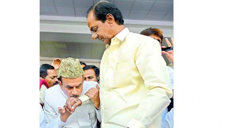 Mohammad Mahmood Ali, the first deputy Chief Minister of Telangana kisses hand of K. Chandrasekhar Rao. Mohammad Mahmood Ali, the first deputy Chief Minister of Telangana kisses hand of K. Chandrasekhar Rao.