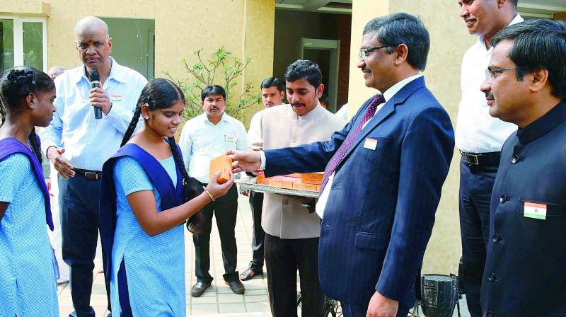 Special chief secretary (CMO) distribute sweets to school children at secretariat on Friday. (Photo: DC) Special chief secretary (CMO) distribute sweets to school children at secretariat on Friday. (Photo: DC)