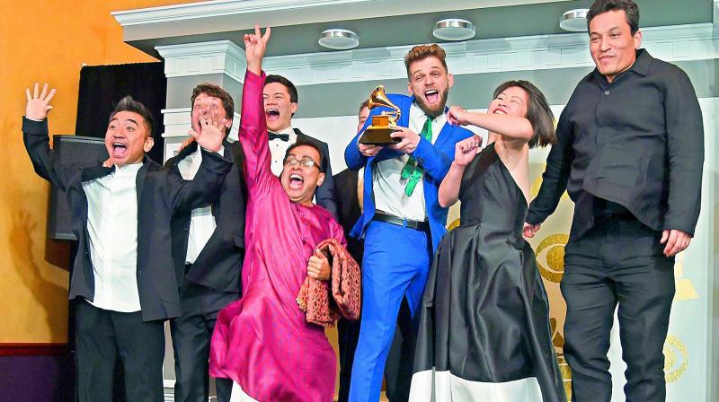 The Silk Road Ensemble pose with the Best World Music Album Grammy award The Silk Road Ensemble pose with the Best World Music Album Grammy award
