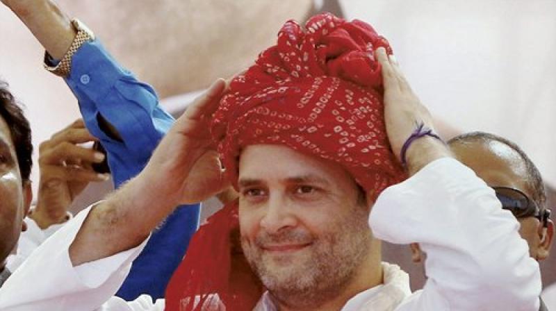 Congress vice president Rahul Gandhi, who had on Monday described GST as 'Gabbar Singh Tax' during a rally in Gujarat, on Tuesday recalled a much quoted dialogue from 'Sholay' to sharpen his attack on Prime Minister Narendra Modi. (Photo: PTI) Congress vice president Rahul Gandhi, who had on Monday described GST as 'Gabbar Singh Tax' during a rally in Gujarat, on Tuesday recalled a much quoted dialogue from 'Sholay' to sharpen his attack on Prime Minister Narendra Modi. (Photo: PTI)