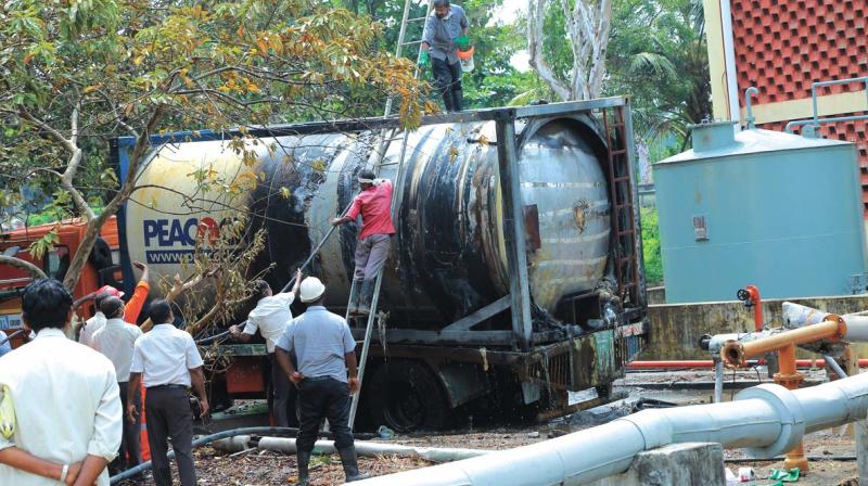Fire personnel and others douse the fire following a fire and explosion at the Hindustan Insecticides Limited (HIL) at Kalamassery in Kochi on Wednesday. Fire personnel and others douse the fire following a fire and explosion at the Hindustan Insecticides Limited (HIL) at Kalamassery in Kochi on Wednesday.