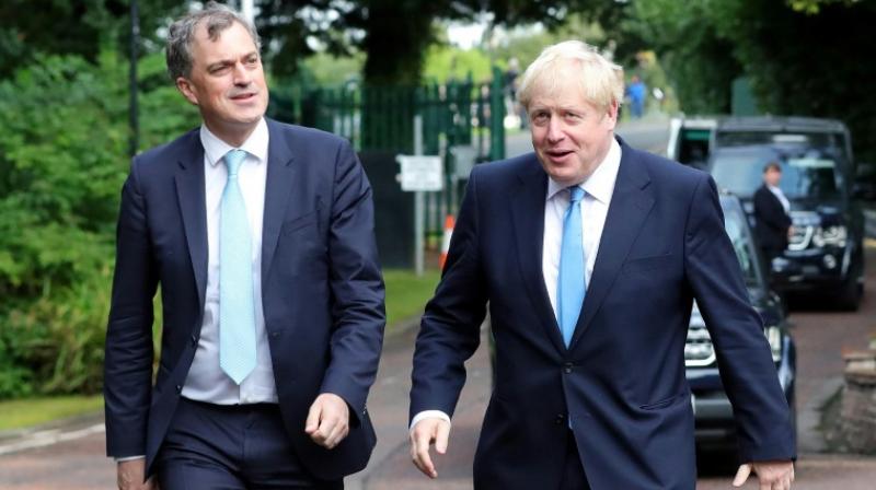 Johnson (R) was accompanied by Britain's Northern Ireland Secretary Julian Smith (L) on his visit to Belfast. (Photo: AFP) Johnson (R) was accompanied by Britain's Northern Ireland Secretary Julian Smith (L) on his visit to Belfast. (Photo: AFP)