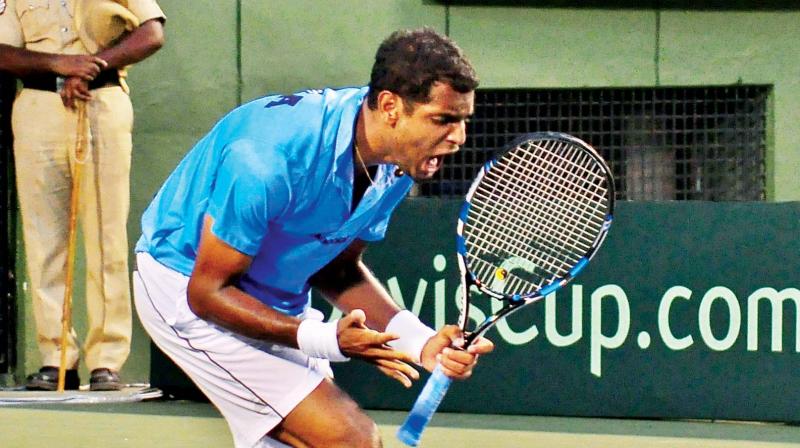 Prajnesh Gunneswaran in action against Sanjar Fayziev on Friday. (Photo: SATISH. B) Prajnesh Gunneswaran in action against Sanjar Fayziev on Friday. (Photo: SATISH. B)