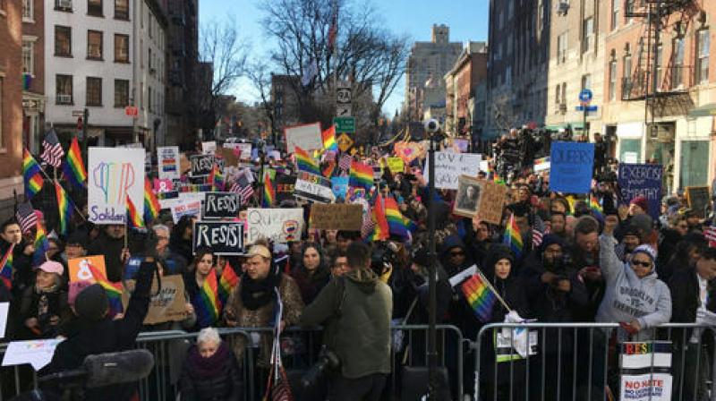 Protesters opposed to President Donald Trump's Immigration policy gather outside the Stonewall Inn. (Photo: AP) Protesters opposed to President Donald Trump's Immigration policy gather outside the Stonewall Inn. (Photo: AP)