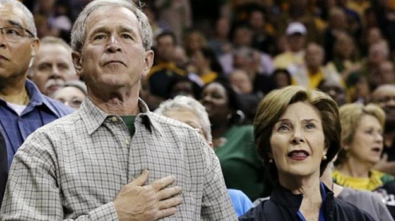 Former President George W. Bush with his wife Laura. (Photo: AP) Former President George W. Bush with his wife Laura. (Photo: AP)