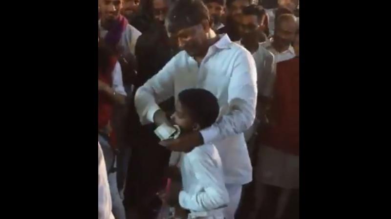 Goud, who represents Secunderabad, reportedly pushed wads of Rs 500 notes in the child’s mouth while the child kept playing the drums. (Photo: Screengrab) Goud, who represents Secunderabad, reportedly pushed wads of Rs 500 notes in the child’s mouth while the child kept playing the drums. (Photo: Screengrab)