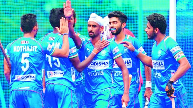 Members of the Indian men’s teams celebrate goals during the finals of the Olympic Test event in Tokyo on Wednesday. Members of the Indian men’s teams celebrate goals during the finals of the Olympic Test event in Tokyo on Wednesday.