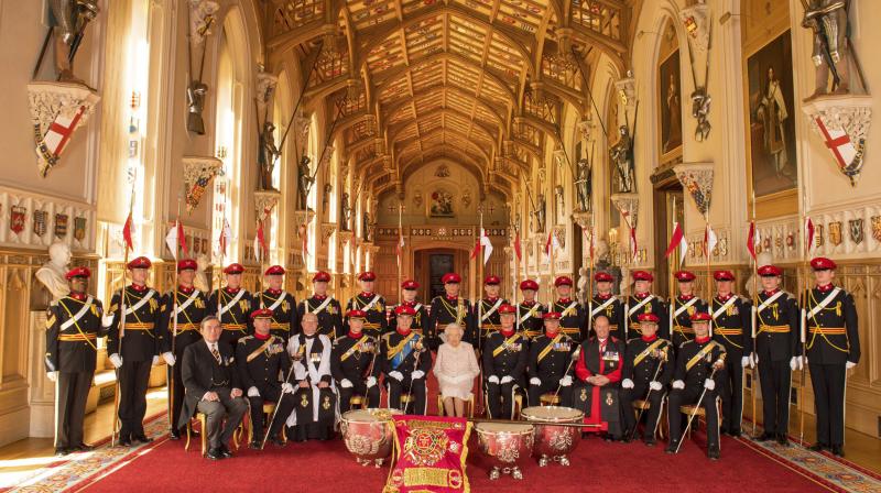 Britain's Queen Elizabeth II, center, poses for a picture following the presentation of the Guidon to the Royal Lancers by Queen Elizabeth II at Windsor Castle, in Berkshire. (Photo: AP) Britain's Queen Elizabeth II, center, poses for a picture following the presentation of the Guidon to the Royal Lancers by Queen Elizabeth II at Windsor Castle, in Berkshire. (Photo: AP)