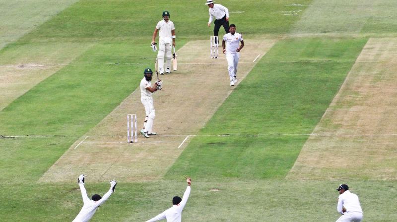 Hashim Amla was given not out by umpire Aleem Dar following an appeal for leg before wicket, two balls after left-arm opening bowler Vishwa Fernando had Dean Elgar caught behind in just the second over. (Photo: AFP) Hashim Amla was given not out by umpire Aleem Dar following an appeal for leg before wicket, two balls after left-arm opening bowler Vishwa Fernando had Dean Elgar caught behind in just the second over. (Photo: AFP)