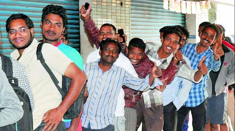 People stand in a queue to purchase tickets for the upcoming India-New Zeland ODI cricket match at an e-Seva centre in Visakhapatnam on Tuesday. People stand in a queue to purchase tickets for the upcoming India-New Zeland ODI cricket match at an e-Seva centre in Visakhapatnam on Tuesday.