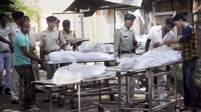 Bodies of SIMI terrorists who were killed in an encounter after they escaped from Central Jail, being handed over to their relatives and family members after post-mortem in Bhopal. (Photo: PTI) Bodies of SIMI terrorists who were killed in an encounter after they escaped from Central Jail, being handed over to their relatives and family members after post-mortem in Bhopal. (Photo: PTI)