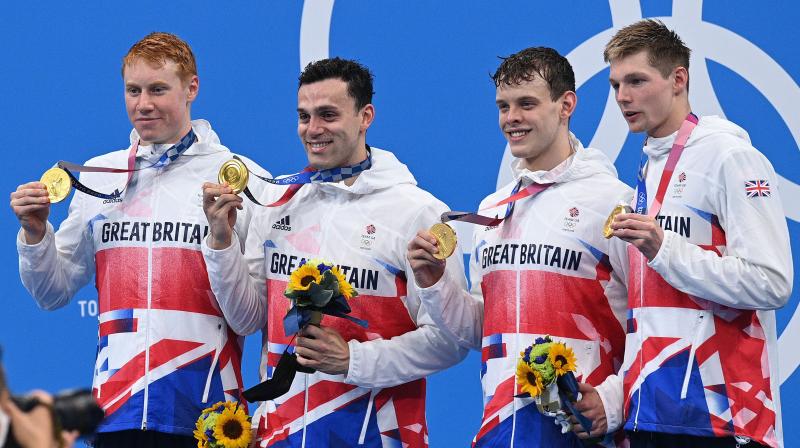 Gold medallists (from left) Britains Tom Dean, James Guy, Matthew Richards and Duncan Scott pose on the podium after the final of the mens 4x200m freestyle relay swimming event during the Tokyo Olympic Games at the Tokyo Aquatics Centre in Tokyo on Wednesday. (Photo:AFP)