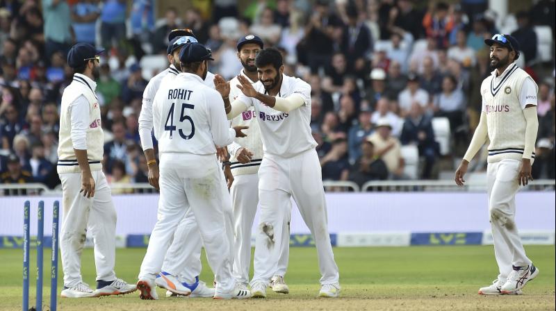 Indias Jasprit Bumrah (second right) and teammates celebrate the dismissal of Englands Stuart Broad during the fourth day of first test cricket match between England and India, at Trent Bridge in Nottingham, England, on Saturday. (Photo: AP)