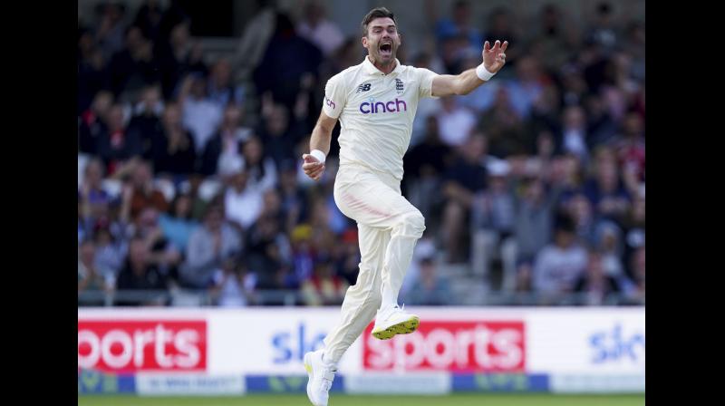 Englands James Anderson celebrates the dismissal of Indias captain Virat Kohli during the first day of third test cricket match between England and India, at Headingley cricket ground in Leeds on Wednesday. (Photo: AP)