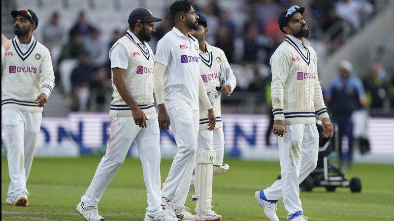 Indias captain Virat Kohli, right, reacts as he walks off the field with teammates at the end of the second day of third test cricket match between England and India, at Headingley cricket ground in Leeds on Thursday. (Photo: AP)