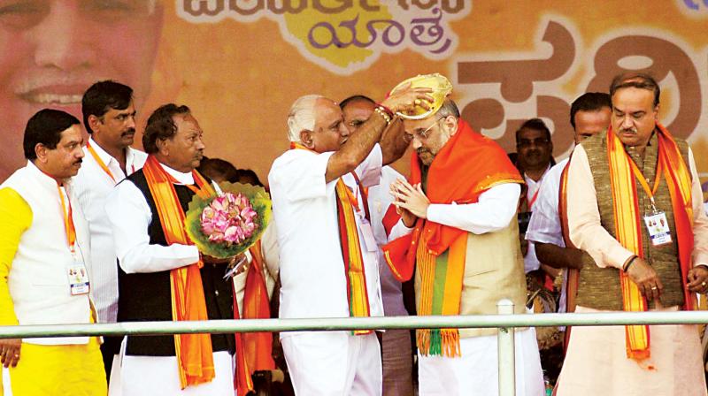 BJP national president Amit Shah being felicitated by party’s state chief B. S. Yeddyurappa at the inaugural function of Parivarthana Yatra in Bengaluru on Thursday. (Photo: KPN) BJP national president Amit Shah being felicitated by party’s state chief B. S. Yeddyurappa at the inaugural function of Parivarthana Yatra in Bengaluru on Thursday. (Photo: KPN)