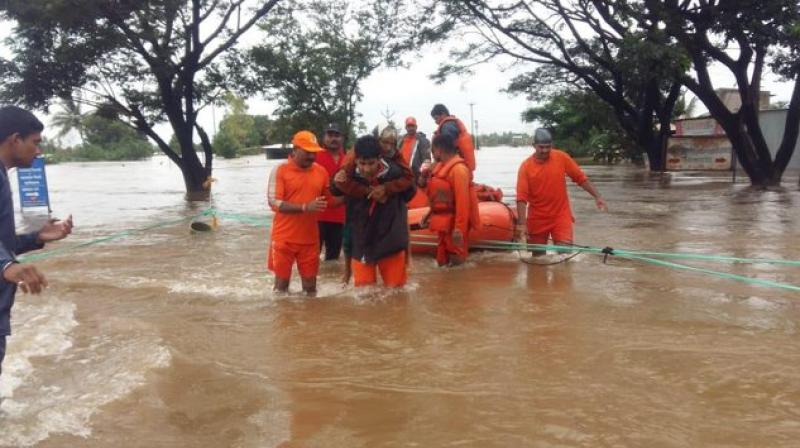 The National Disaster Response Force (NDRF) teams continuing with the rescue and relief operations in Shirol and Kolhapur. (Photo: ANI) The National Disaster Response Force (NDRF) teams continuing with the rescue and relief operations in Shirol and Kolhapur. (Photo: ANI)