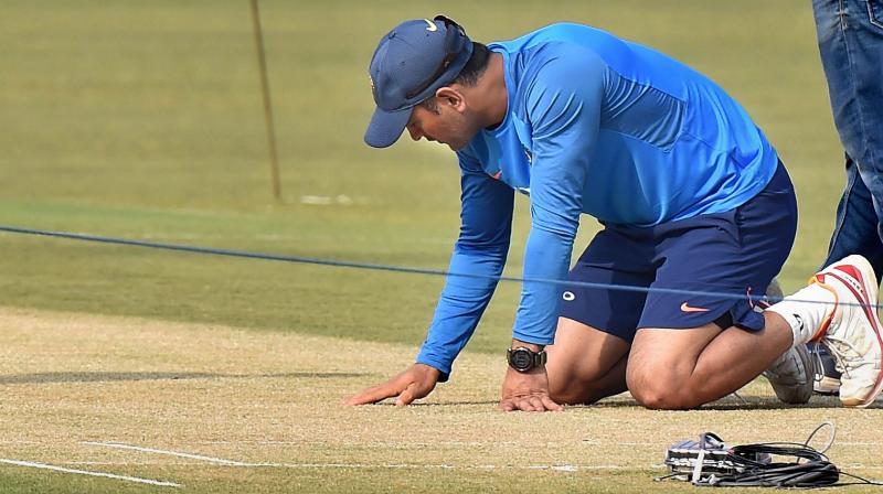 MS Dhoni headed straight to the 22-yard strip after dropping his kit bag and examined it minutely from both ends. (Photo: PTI) MS Dhoni headed straight to the 22-yard strip after dropping his kit bag and examined it minutely from both ends. (Photo: PTI)