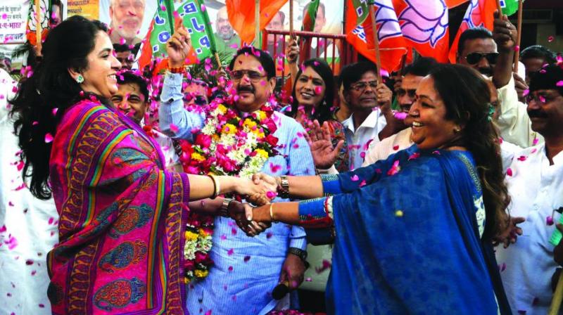A file photo of BJP supporters celebrating the passage of the Bill for 10 per cent EWS quota in Parliament. A file photo of BJP supporters celebrating the passage of the Bill for 10 per cent EWS quota in Parliament.
