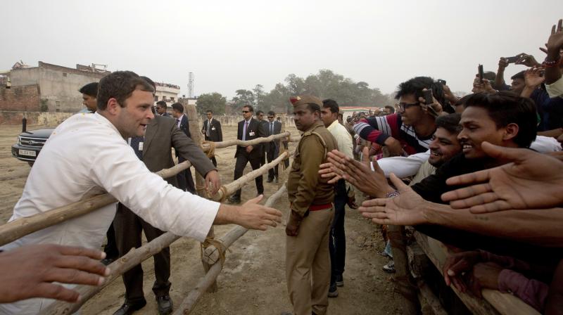Congress party Vice President Rahul Gandhi greets supporters during an election campaign rally in Raebareli. (Photo: PTI) Congress party Vice President Rahul Gandhi greets supporters during an election campaign rally in Raebareli. (Photo: PTI)