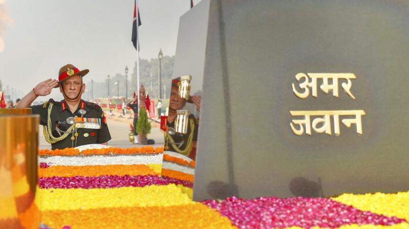 Chief of Army Staff, General Bipin Rawat pays homage to the Martyrs, on the occasion of Infantry Day, at the Amar Jawan Jyoti, India Gate in New Delhi. (Photo: PTI) Chief of Army Staff, General Bipin Rawat pays homage to the Martyrs, on the occasion of Infantry Day, at the Amar Jawan Jyoti, India Gate in New Delhi. (Photo: PTI)