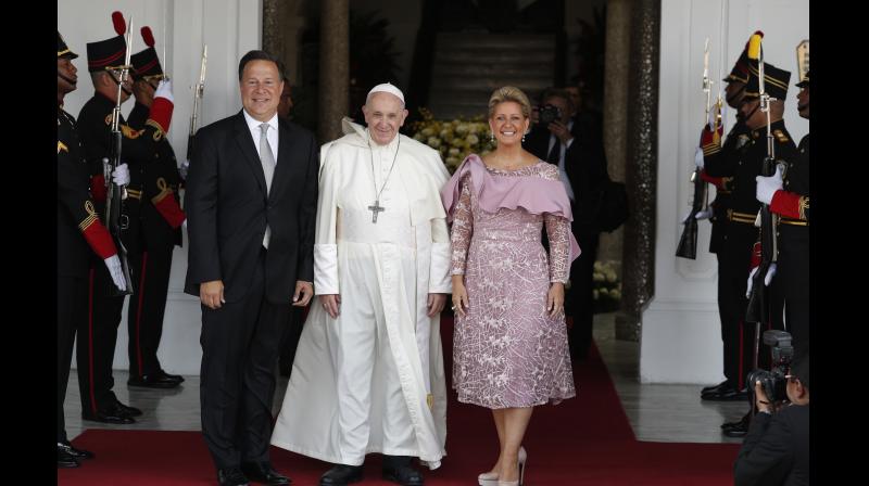 Pope Francis, Panama's President Juan Carlos Varela and first lady Lorena Castillo pose for a photo at entrance of the presidential palace in Panama City. (Photo: AP) Pope Francis, Panama's President Juan Carlos Varela and first lady Lorena Castillo pose for a photo at entrance of the presidential palace in Panama City. (Photo: AP)