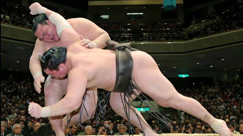 Sumo began a new tournament in front of a live audience Sunday. (AFP Photo) Sumo began a new tournament in front of a live audience Sunday. (AFP Photo)