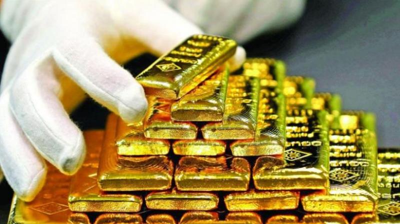 Gold rises by Rs 97, silver almost flat . (AFP Photo)