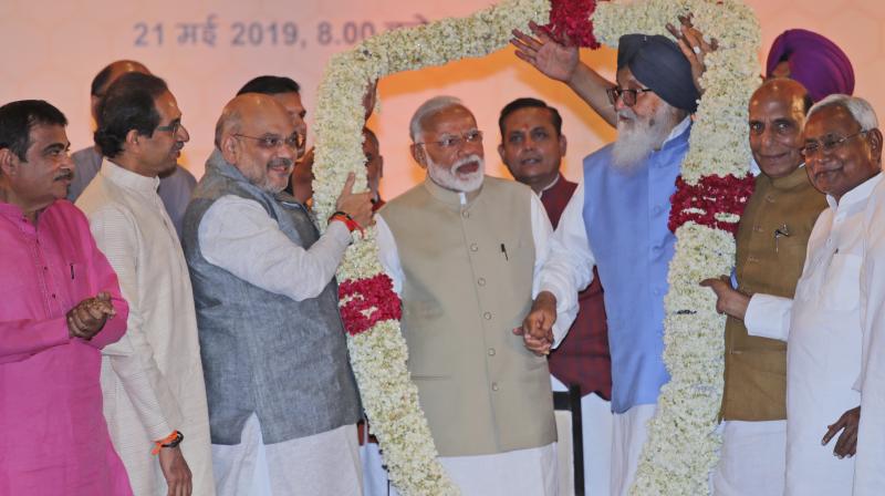 Hailing Modi’s leadership and expressing faith in him, the resolution adopted by NDA leaders said their alliance is a true representative of India’s diversity and dynamism. (Photo: AP) Hailing Modi’s leadership and expressing faith in him, the resolution adopted by NDA leaders said their alliance is a true representative of India’s diversity and dynamism. (Photo: AP)