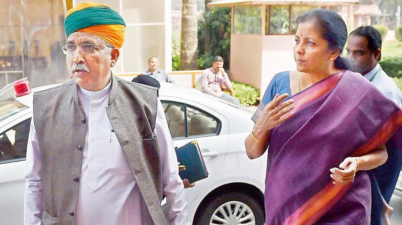Minister of State for finance Arjun Ram Meghwal with Commerce minister Nirmala Sitharaman during the Budget session of Parliament in New Delhi on Monday (Photo: AP) Minister of State for finance Arjun Ram Meghwal with Commerce minister Nirmala Sitharaman during the Budget session of Parliament in New Delhi on Monday (Photo: AP)