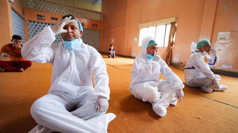 PPE kits, sky decks, city squares: How the world celebrated this years Yoga Day