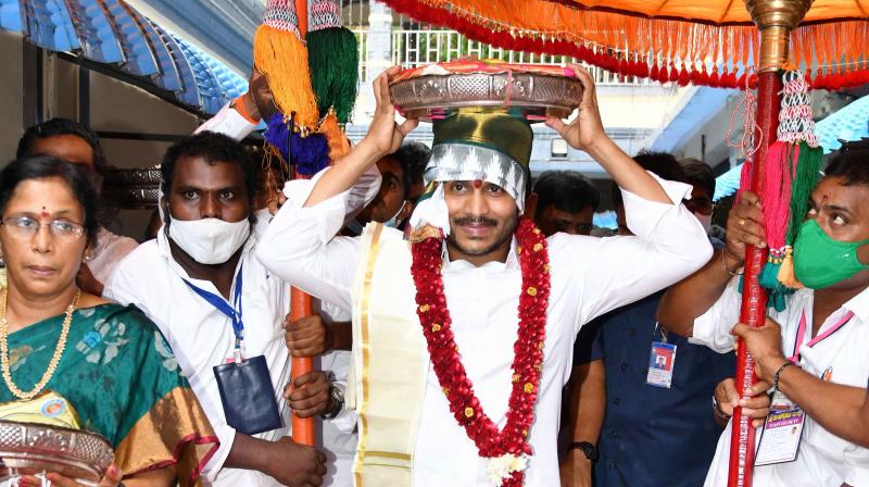 Chief Minister YS Jagan Mohan Reddy carrying Silk Robes to Goddess Kanakadurga on the occasion of Moola Nakshatram as part of Dasara celebrations on Indrakeeladri in Vijayawada on Tuesday. (By Arrangement)