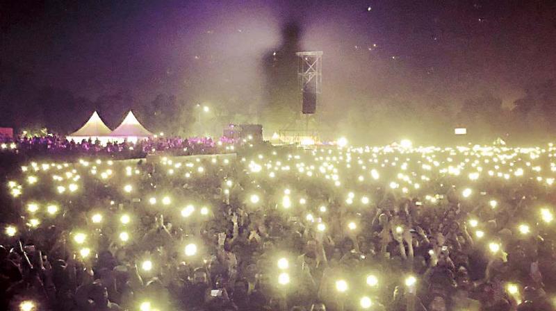 The image was his shadow eerily cast into the dusty and smoky air above a concert crowd. The image was his shadow eerily cast into the dusty and smoky air above a concert crowd.