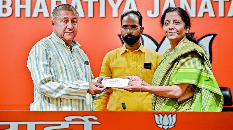 RJD leader Girinath Singh joins BJP in presence of Nirmala Sitharaman in New Delhi. (PTI) RJD leader Girinath Singh joins BJP in presence of Nirmala Sitharaman in New Delhi. (PTI)