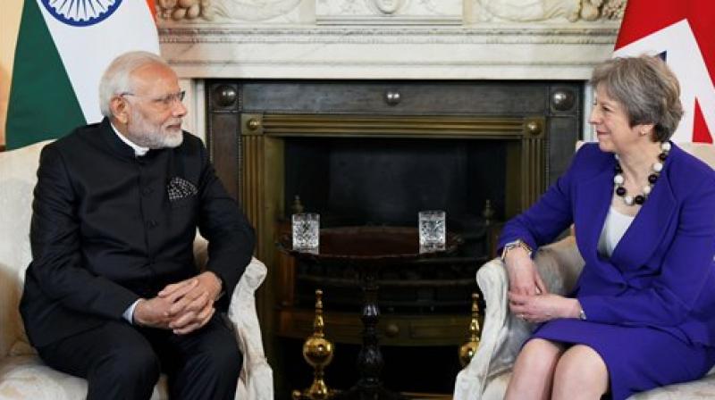 According to a report, a spokesperson of 10 Downing Street said British PM Theresa May and PM Modi had discussed cooperation between the two countries on legal matters. (Photo: PTI) According to a report, a spokesperson of 10 Downing Street said British PM Theresa May and PM Modi had discussed cooperation between the two countries on legal matters. (Photo: PTI)
