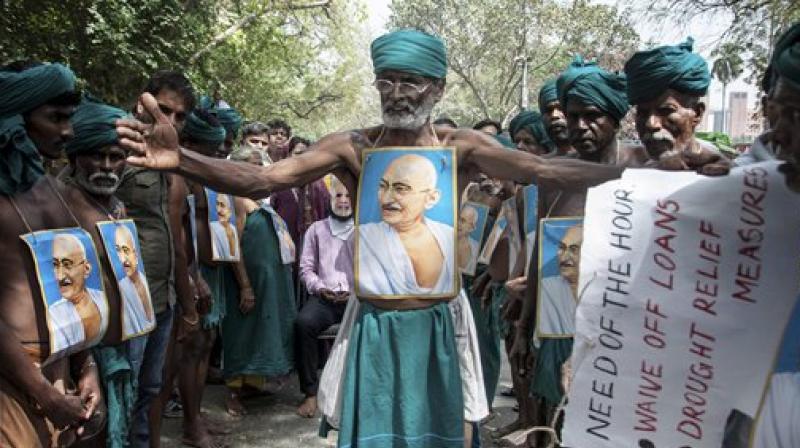 Tamil farmers shout slogans during their protest demanding loan waiver and compensation for crop failure at Jantar Mantar in New Delhi. (Photo: PTI) Tamil farmers shout slogans during their protest demanding loan waiver and compensation for crop failure at Jantar Mantar in New Delhi. (Photo: PTI)
