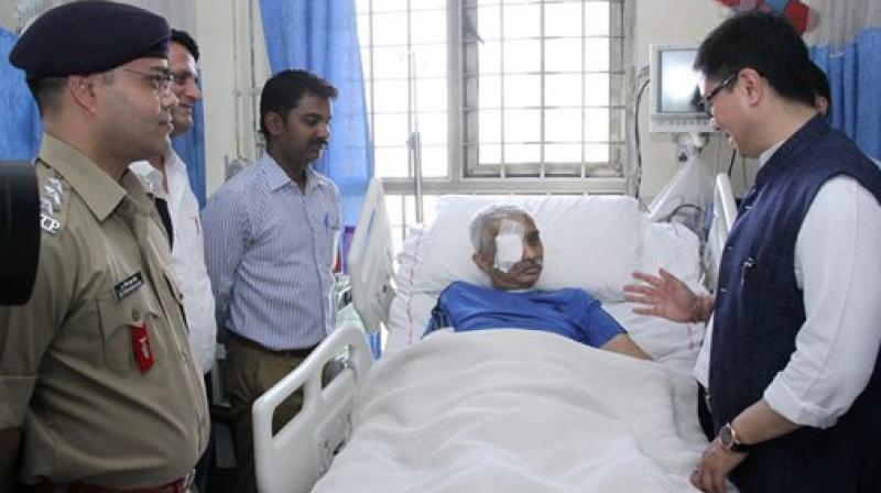 Minister of State for Home Affairs, Kiren Rijiju seeing the CRPF Commandant, Chetan Kumar Cheetah at AIIMS, who survived fatal bullet injuries in an encounter in Jammu and Kashmir in February this year, in New Delhi on Wednesday. (Photo: PTI) Minister of State for Home Affairs, Kiren Rijiju seeing the CRPF Commandant, Chetan Kumar Cheetah at AIIMS, who survived fatal bullet injuries in an encounter in Jammu and Kashmir in February this year, in New Delhi on Wednesday. (Photo: PTI)