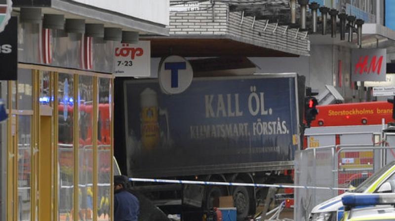 The rear of a truck, left, protrudes after it crashed into a department store injuring several people in central Stockholm, Sweden, Friday April 7, 2017. (Photo: AP) The rear of a truck, left, protrudes after it crashed into a department store injuring several people in central Stockholm, Sweden, Friday April 7, 2017. (Photo: AP)