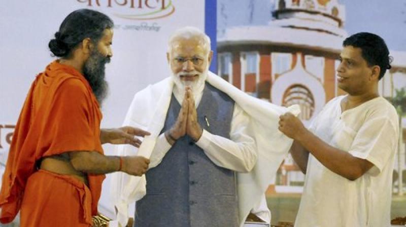 Baba Ramdev along with Prime Minister Narendra Modi. Baba Ramdev along with Prime Minister Narendra Modi.