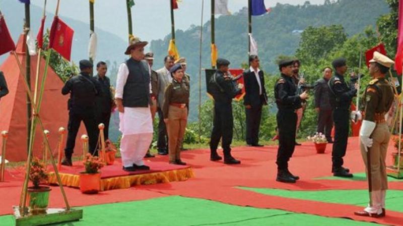 Union Home Minister Rajnath Singh taking salute during his visit to the 36th Batallion Gayzing in western Sikkim on Sunday. (Photo: PTI) Union Home Minister Rajnath Singh taking salute during his visit to the 36th Batallion Gayzing in western Sikkim on Sunday. (Photo: PTI)