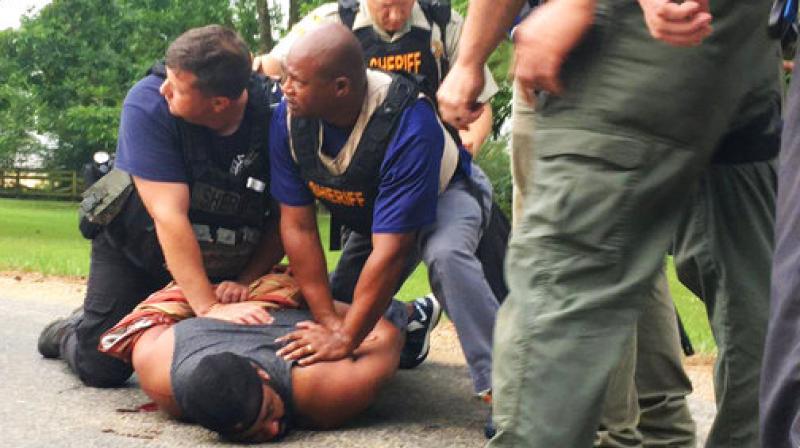 Officers arrest suspect Cory Godbolt on Sunday, May 28, 2017, following several fatal shootings Saturday in Lincoln County, Miss., officials said. (Photo: AP) Officers arrest suspect Cory Godbolt on Sunday, May 28, 2017, following several fatal shootings Saturday in Lincoln County, Miss., officials said. (Photo: AP)