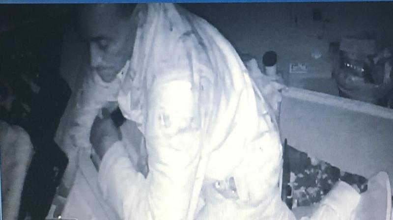 Surveillance camera grab of the burglar gorging on food at E&L Barbeque restaurant. (Photo: Facebook/ E&L Barbeque) Surveillance camera grab of the burglar gorging on food at E&L Barbeque restaurant. (Photo: Facebook/ E&L Barbeque)