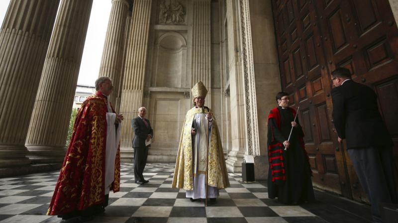 Sarah Mullally, centre, arrives to be installed as the 133d Bishop of London during a service at St Paul's Cathedral in London, Saturday May 12, 2018. Bishop Sarah had a career in the National Health Service as a nurse, before her ordination. (Photo: AP) Sarah Mullally, centre, arrives to be installed as the 133d Bishop of London during a service at St Paul's Cathedral in London, Saturday May 12, 2018. Bishop Sarah had a career in the National Health Service as a nurse, before her ordination. (Photo: AP)