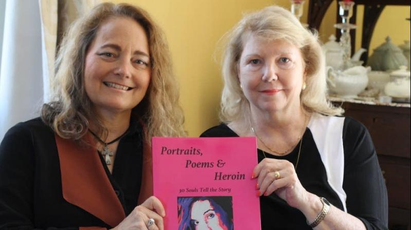 Poet Mary Ellen D'Angelo-Lombardi (left) and artist Anne Marie Zanfagna display their book on Monday, May 7, 2018 in Plaistow, N.H. The book, called "Portraits, Poems & Heroin: 30 Souls Tell the Story," combines poetry D'Angelo-Lombardi wrote about her son's friend who died of an overdose with portraits Zanfagna painted of her daughter and other overdose victims. (Photo: AP) Poet Mary Ellen D'Angelo-Lombardi (left) and artist Anne Marie Zanfagna display their book on Monday, May 7, 2018 in Plaistow, N.H. The book, called "Portraits, Poems & Heroin: 30 Souls Tell the Story," combines poetry D'Angelo-Lombardi wrote about her son's friend who died of an overdose with portraits Zanfagna painted of her daughter and other overdose victims. (Photo: AP)