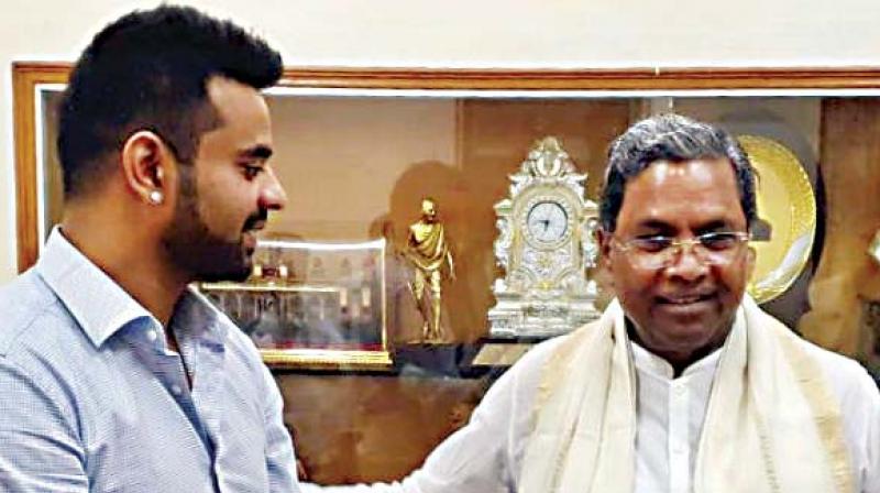 Hassan candidate Prajwal Revanna with Cong leader Siddaramaiah Hassan candidate Prajwal Revanna with Cong leader Siddaramaiah