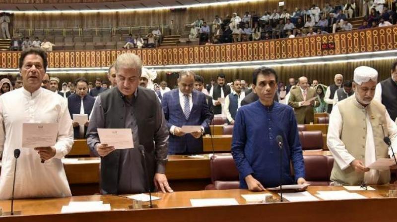 A hand out image made available by the Pakistan National Assembly on August 13, 2018, shows (from L to R) Pakistan's cricketer-turned politician and head of the Pakistan Tehreek-e-Insaf (Movement for Justice) party Imran Khan, Shah Mahmood Qureshi, Khalid Maqbool , Sardar Akhtar Mengal and others taking the oath as Members of Parliament during the first session of the Parliament in Islamabad following general election. (Photo: AFP) A hand out image made available by the Pakistan National Assembly on August 13, 2018, shows (from L to R) Pakistan's cricketer-turned politician and head of the Pakistan Tehreek-e-Insaf (Movement for Justice) party Imran Khan, Shah Mahmood Qureshi, Khalid Maqbool , Sardar Akhtar Mengal and others taking the oath as Members of Parliament during the first session of the Parliament in Islamabad following general election. (Photo: AFP)