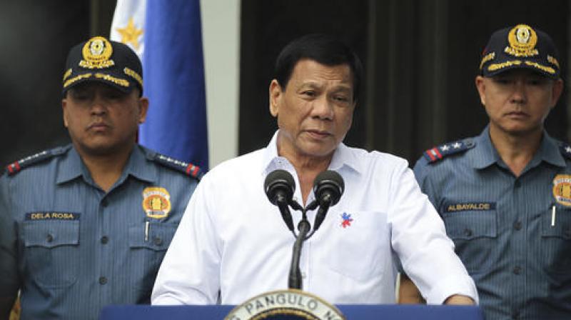Philippine President Rodrigo Duterte, center, speaks to erring policemen during an audience at the Presidential Palace grounds in Manila, Philippines on February 9. (Photo: AP) Philippine President Rodrigo Duterte, center, speaks to erring policemen during an audience at the Presidential Palace grounds in Manila, Philippines on February 9. (Photo: AP)