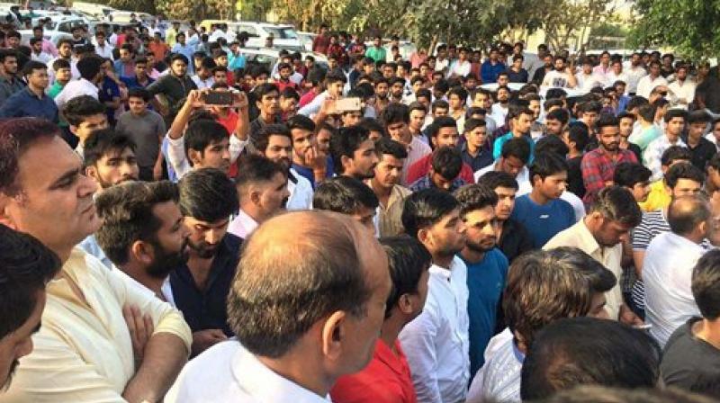 People holding a protest against African nationals over the death of a teenager allegedly due to drug supplied by Nigerians, in Greater Noida on Monday. (Photo: PTI) People holding a protest against African nationals over the death of a teenager allegedly due to drug supplied by Nigerians, in Greater Noida on Monday. (Photo: PTI)